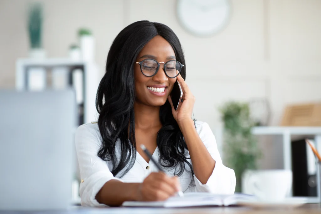 Home 19 happy young black woman in formal wear talking on 2022 10 07 02 22 10 utc