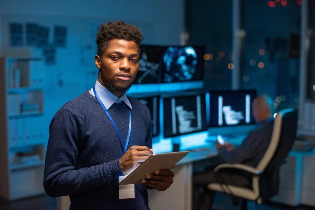Defend Against Threats with SIEM Plus XDR PoC 2 young serious african programmer with tablet 2021 12 09 20 55 29 utc